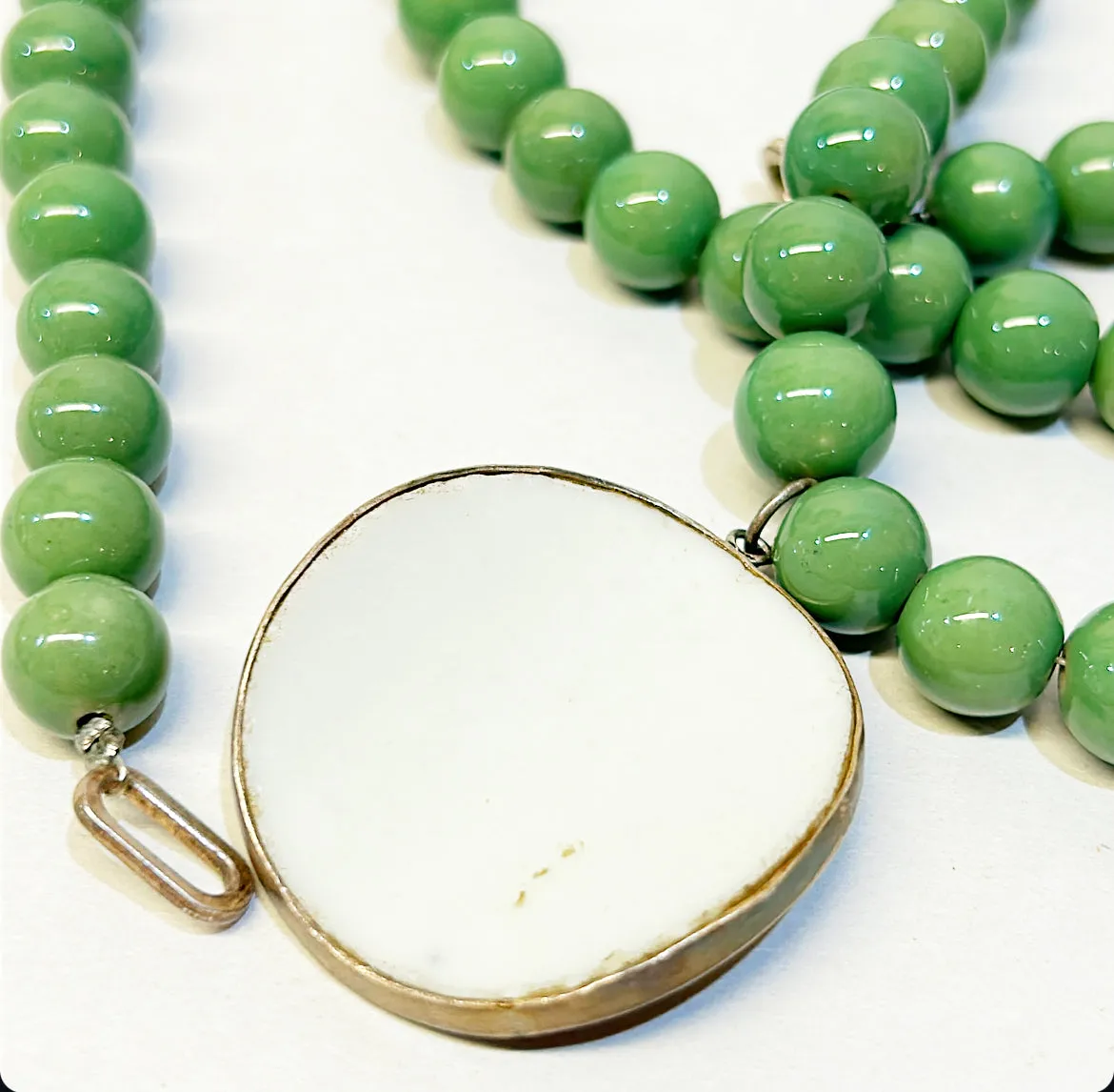 Antique chinoiserie porcelain pendant set in a silver trim pendant