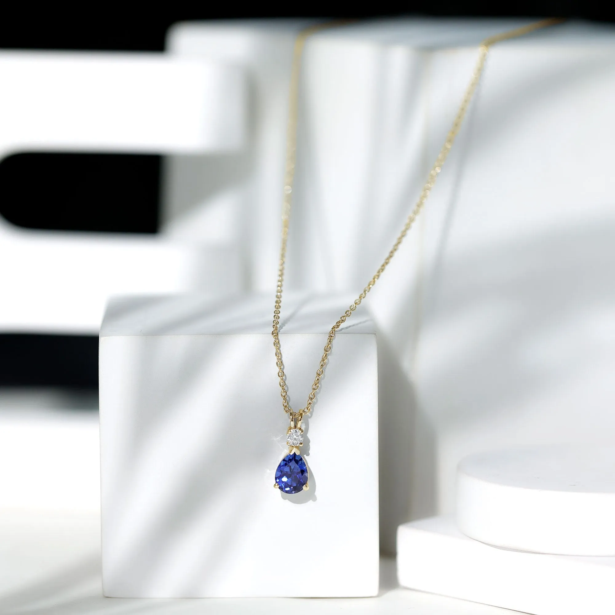 Created Blue Sapphire and Moissanite Modern Teardrop Pendant