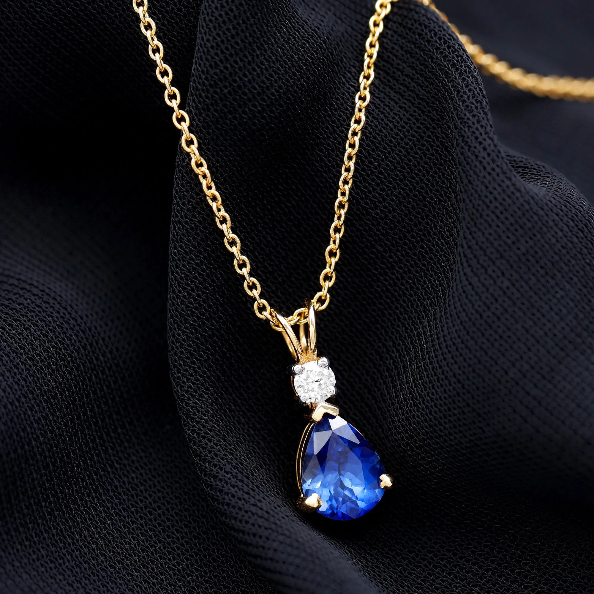 Created Blue Sapphire and Moissanite Modern Teardrop Pendant