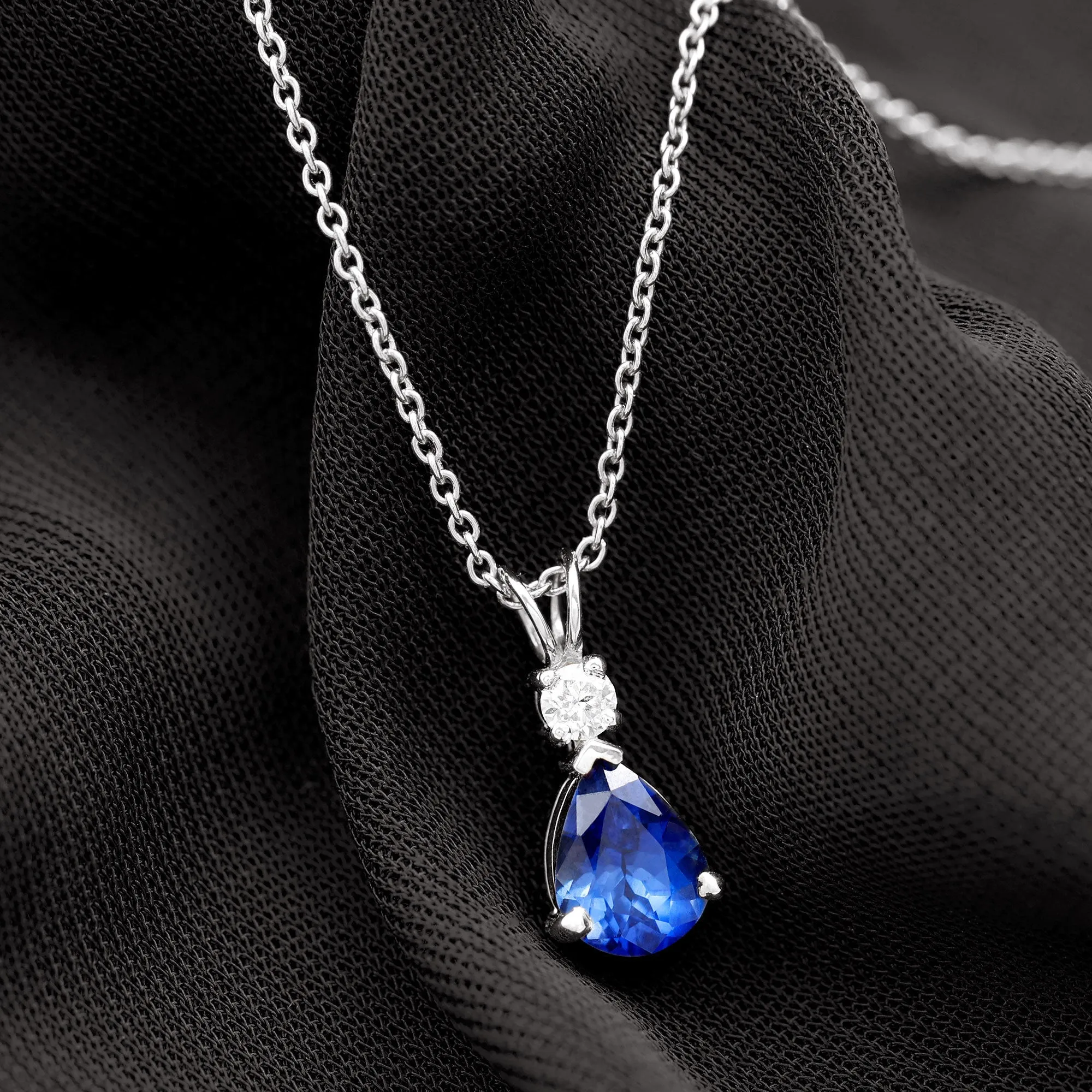 Created Blue Sapphire and Moissanite Modern Teardrop Pendant
