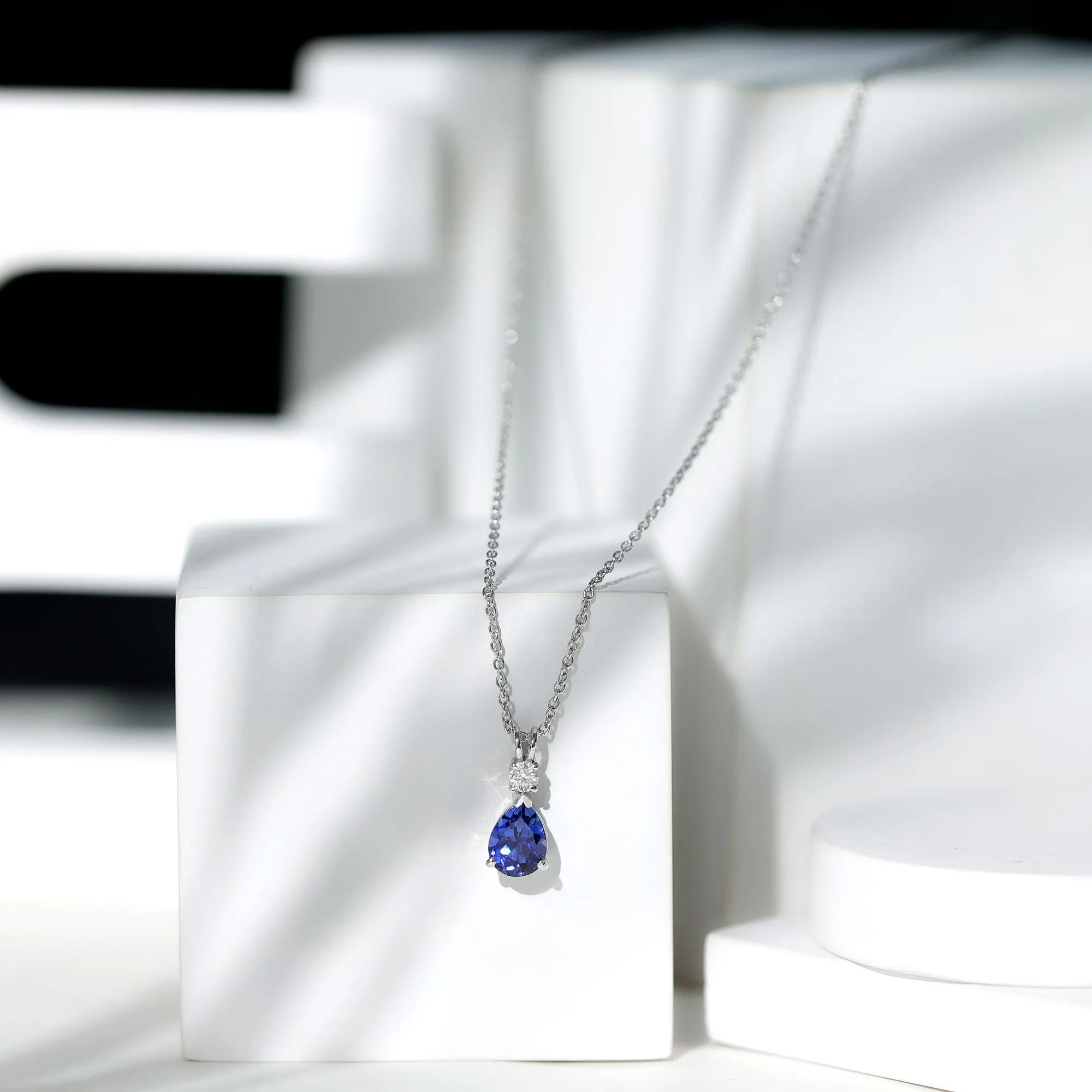 Created Blue Sapphire and Moissanite Modern Teardrop Pendant