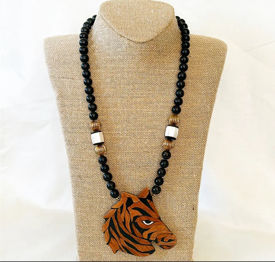 How fun is this? 1980s designer style black beaded necklace with wooden carved lacquered zebra pendant.