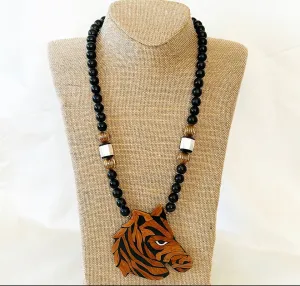 How fun is this? 1980s designer style black beaded necklace with wooden carved lacquered zebra pendant.